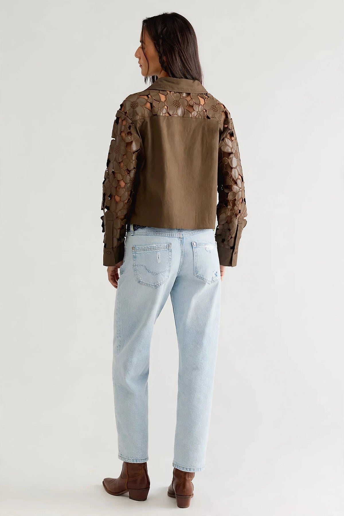 Back view of the Floral Eyelet Blouse with a solid poplin back panel and floral eyelet sleeves in olive brown