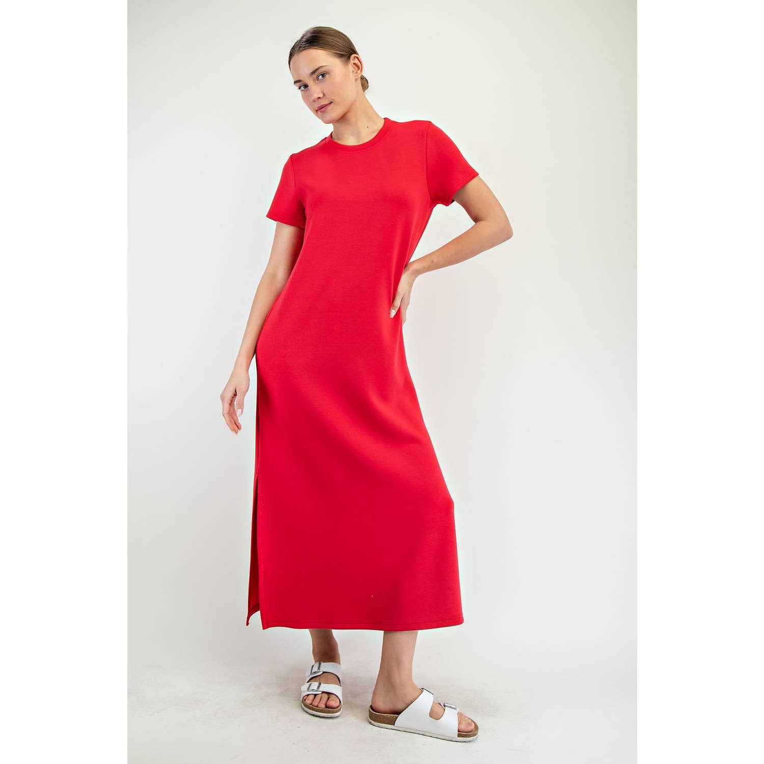Woman wearing a red dress on a white background