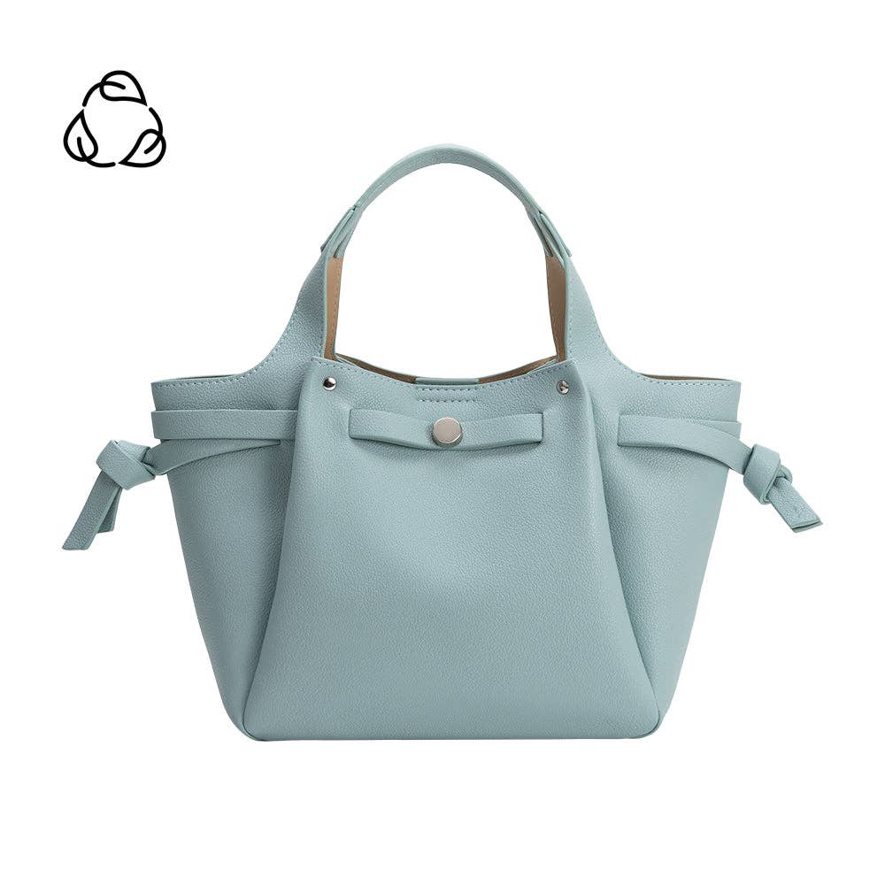 Light blue handbag with ribbon details on a white background