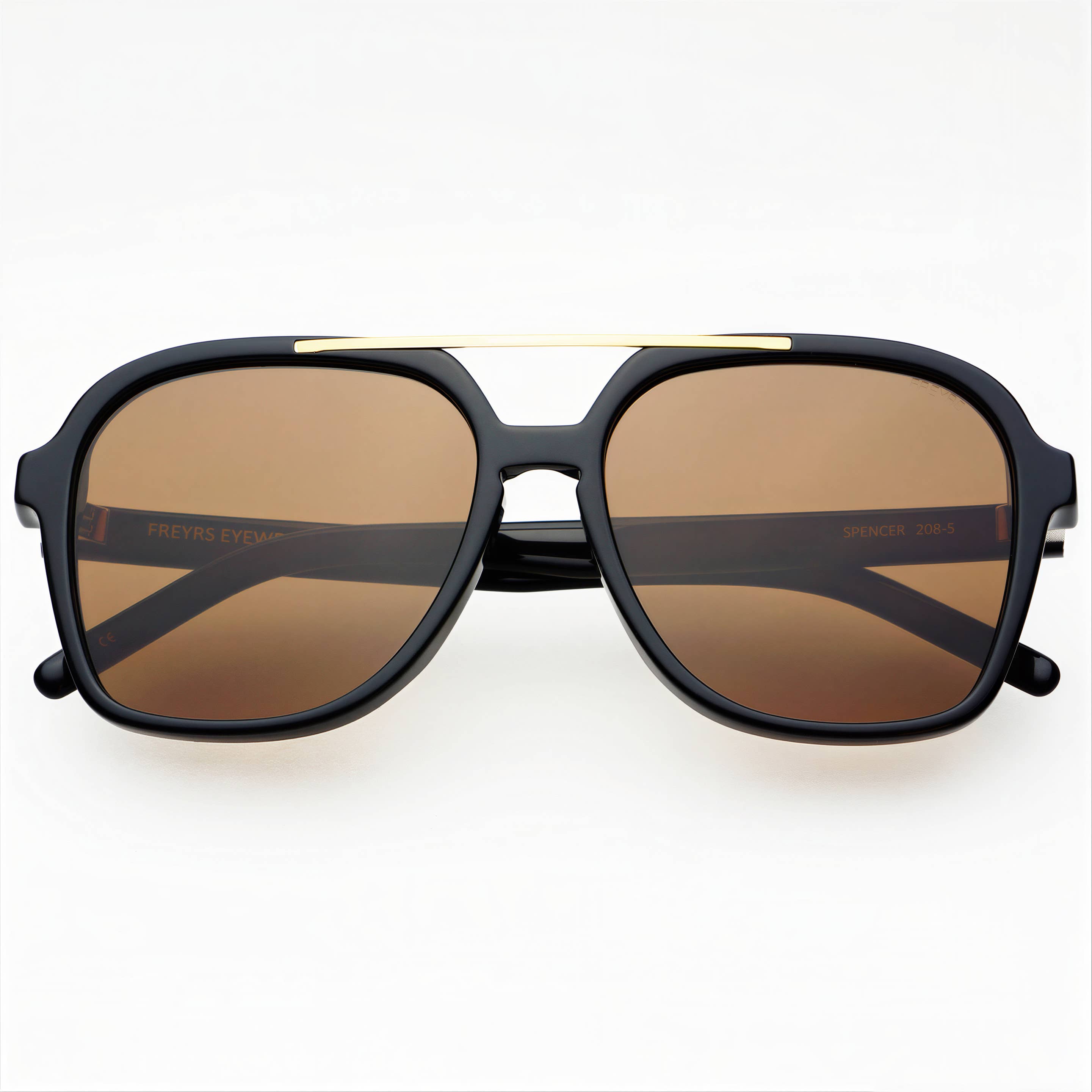 Sunglasses with black frame and brown lenses on a white background