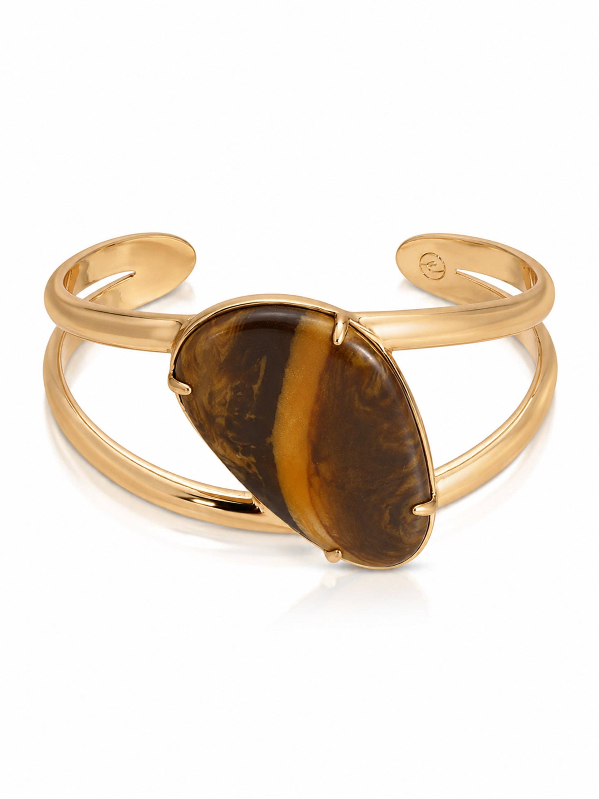 A gold-tone cuff bracelet featuring a large, teardrop-shaped tiger's eye stone with brown and golden-brown marbling, set against a clean white background.