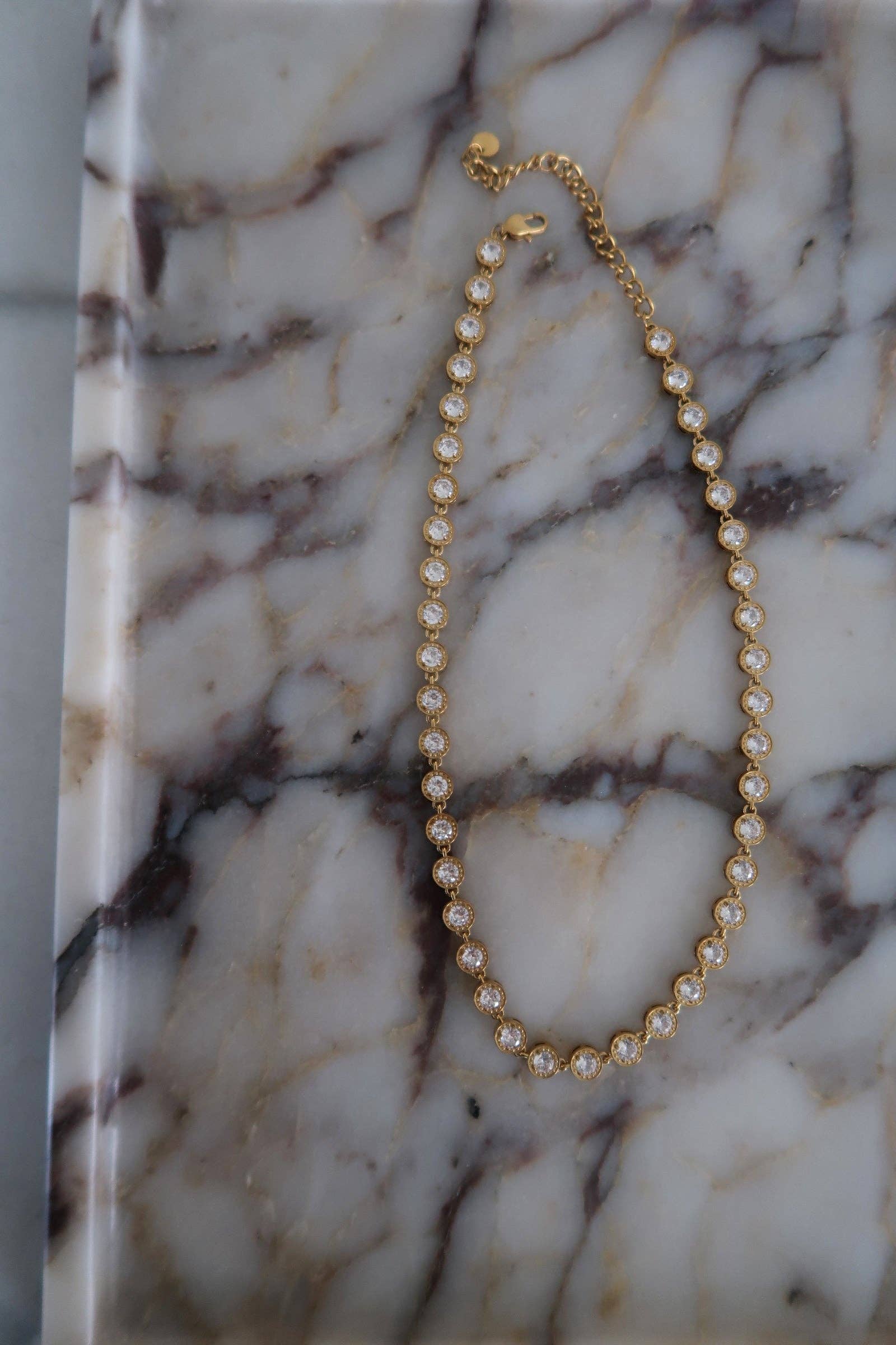 Pearl necklace on a marble surface