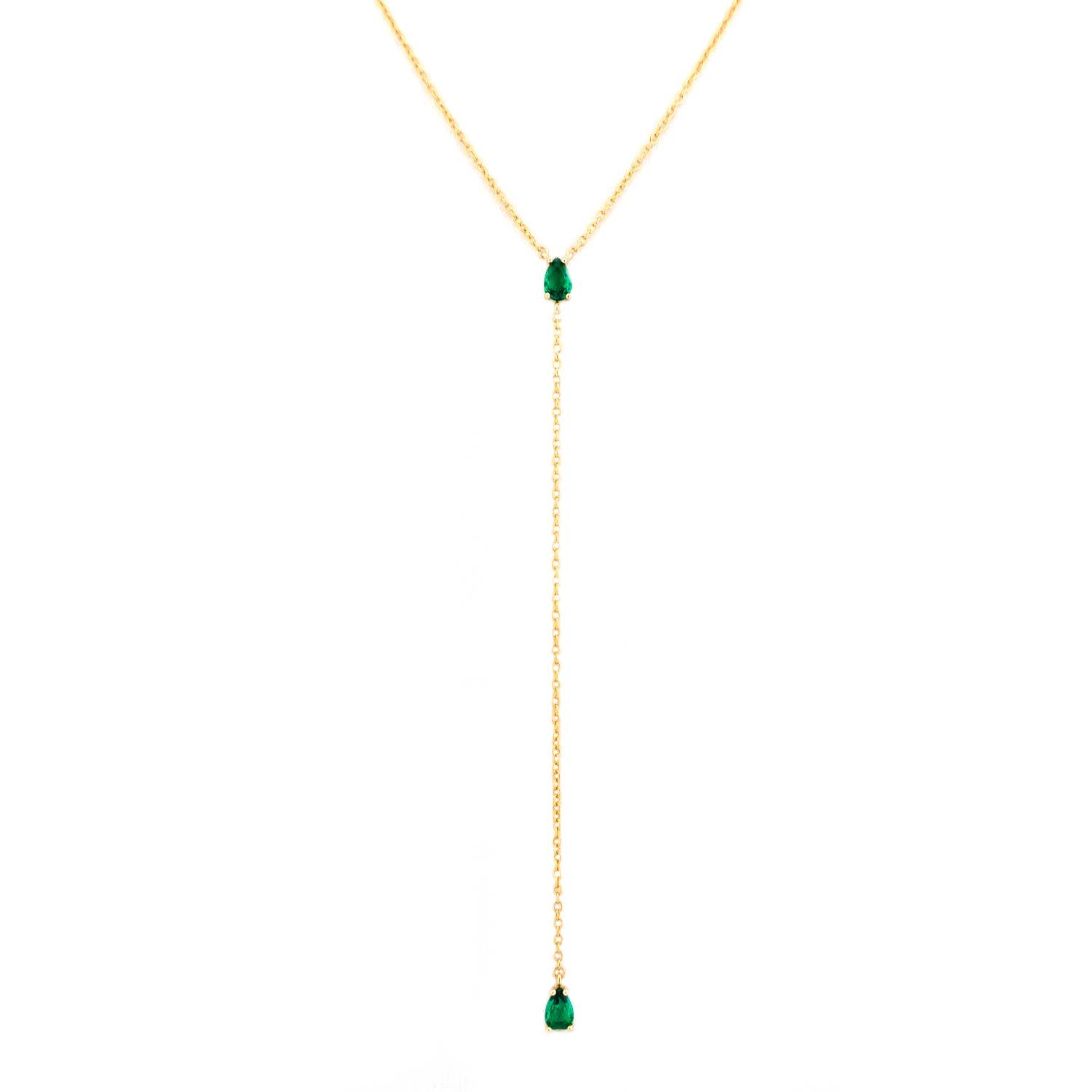 Gold necklace with a green teardrop pendant on a white background