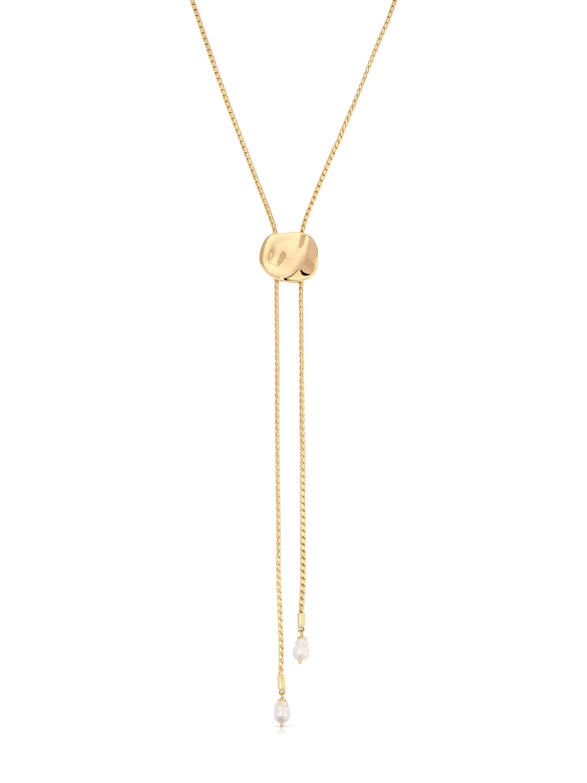 Gold necklace with a round pendant and small beads on a white background