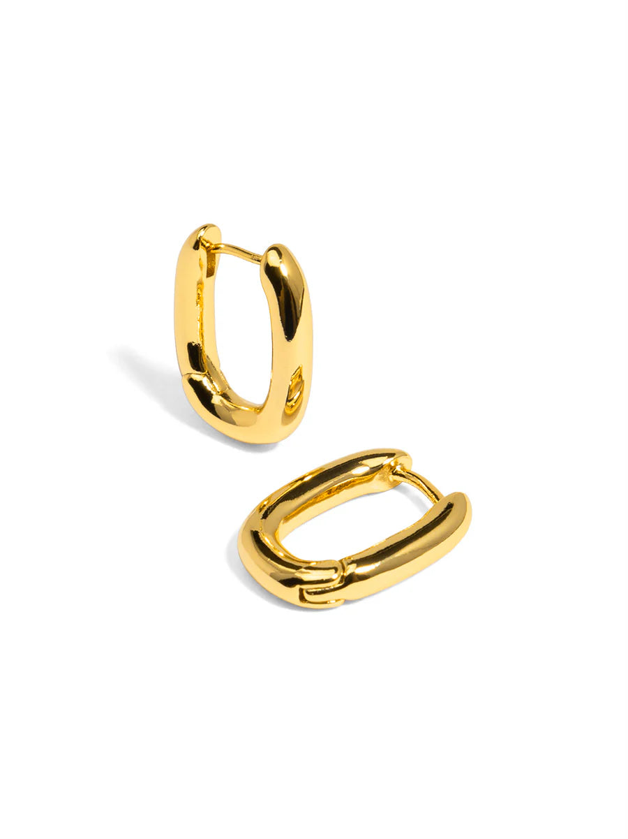 Gold hoop earrings on a white background