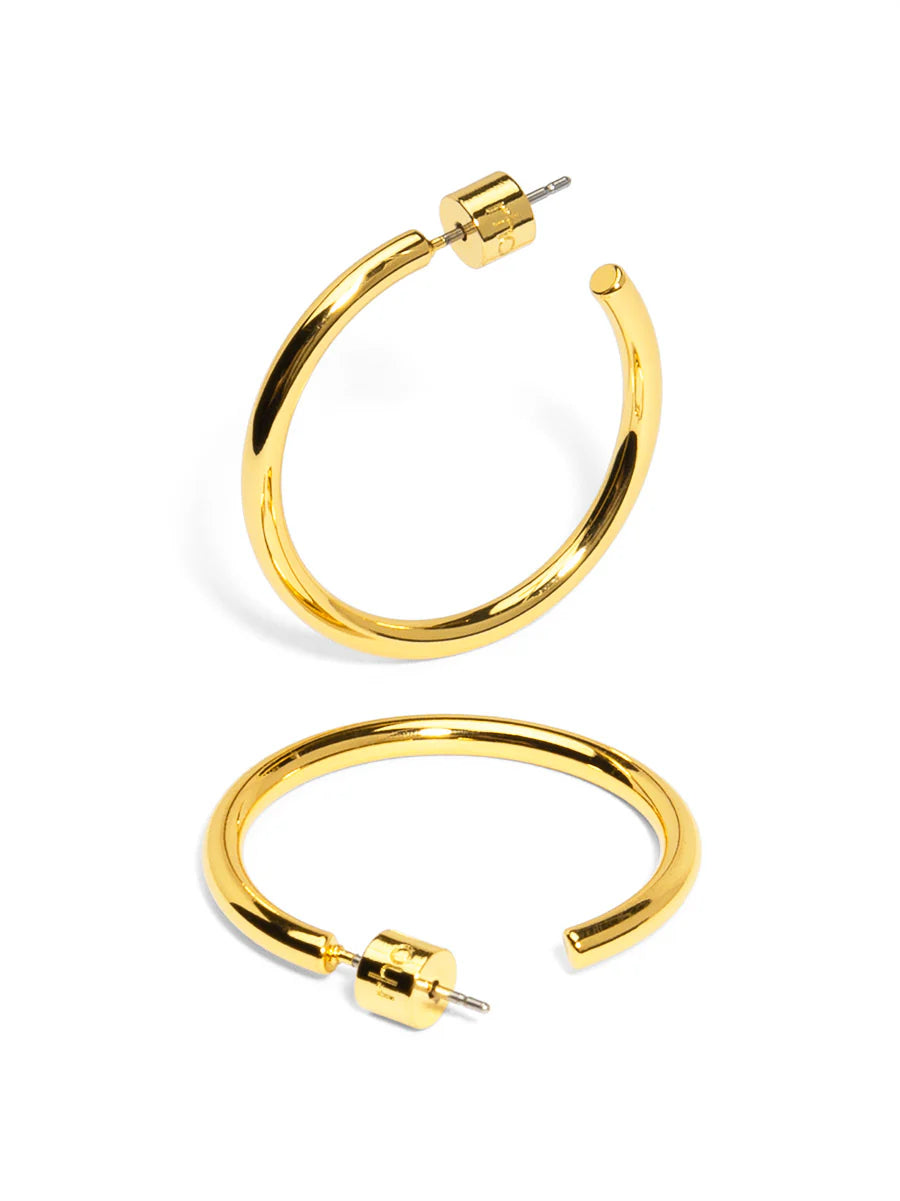 Gold hoop earrings on a white background