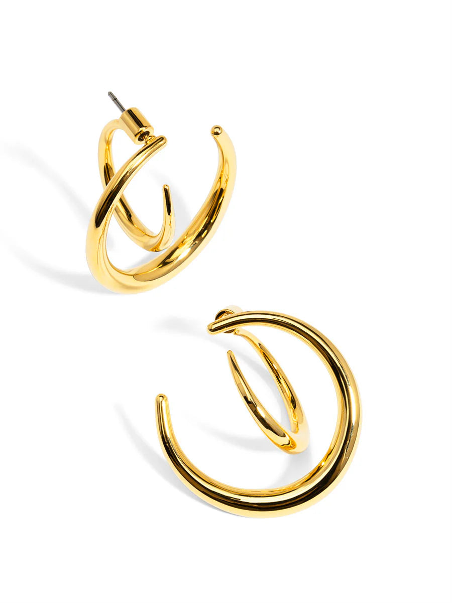 Gold hoop earrings on a white background