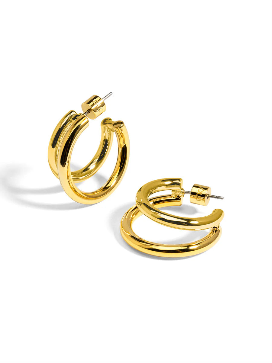 Gold hoop earrings on a white background
