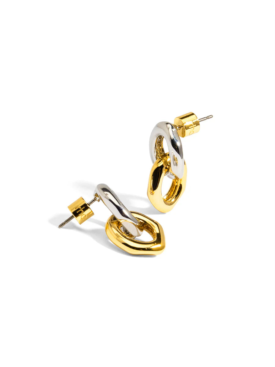 Pair of gold and silver hoop earrings on a white background