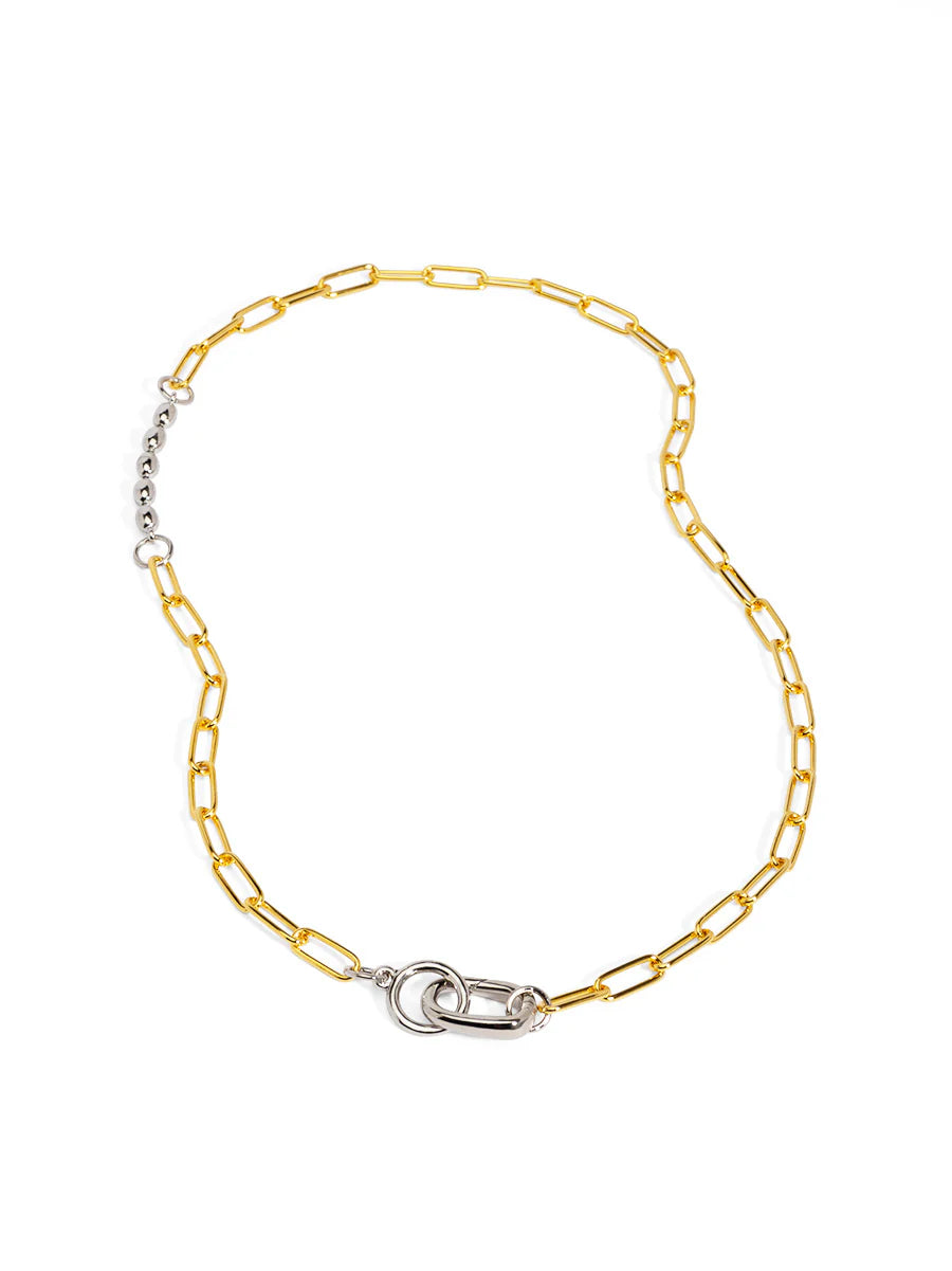 Gold chain necklace with a silver clasp on a white background