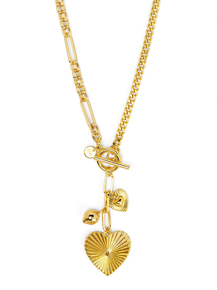 Gold necklace with heart pendant on a white background