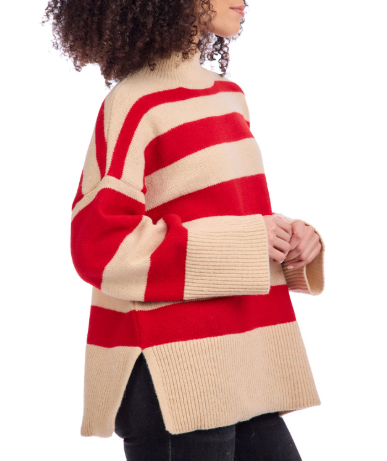 Person wearing a red and beige striped sweater on a white background