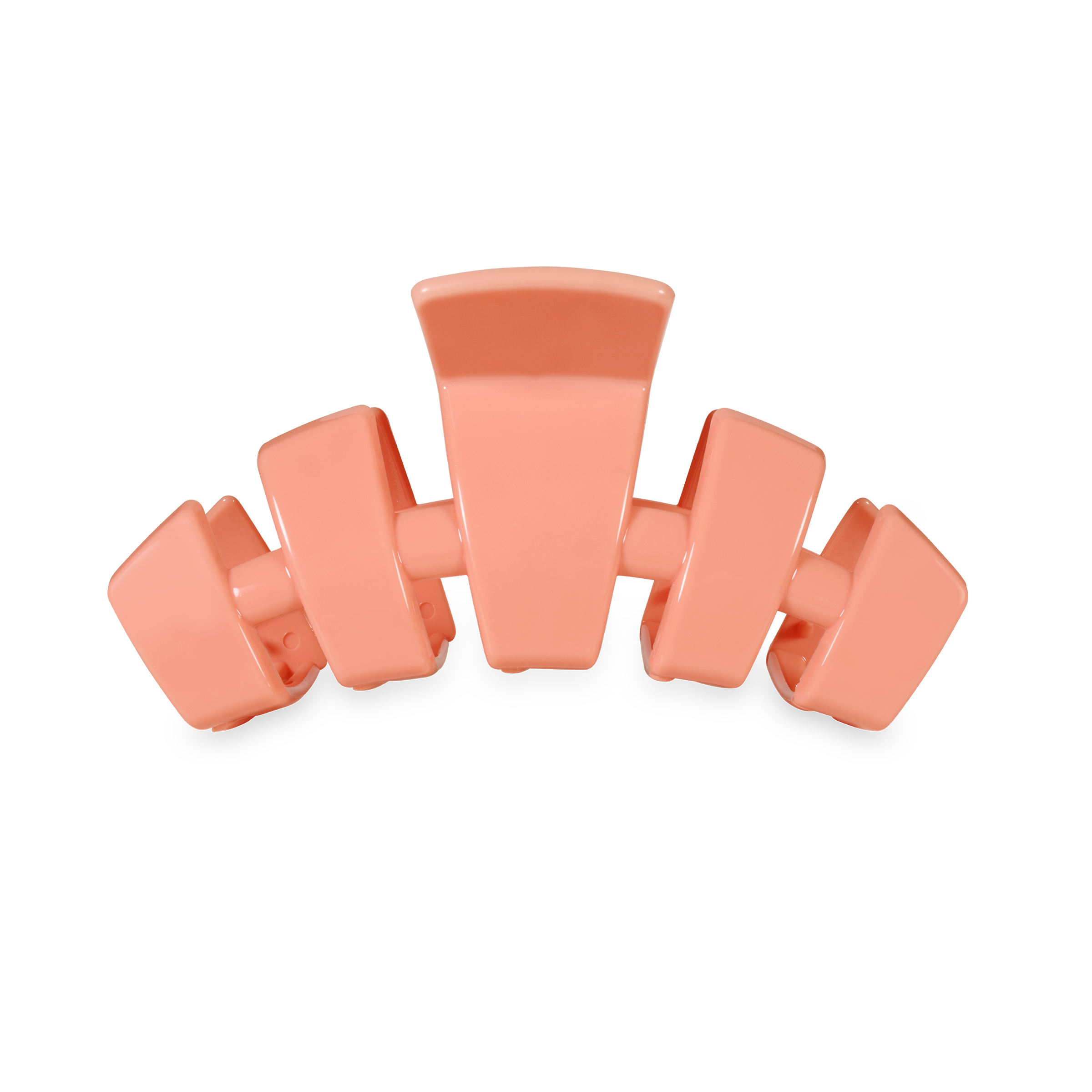 Coral-colored hair clip on a white background