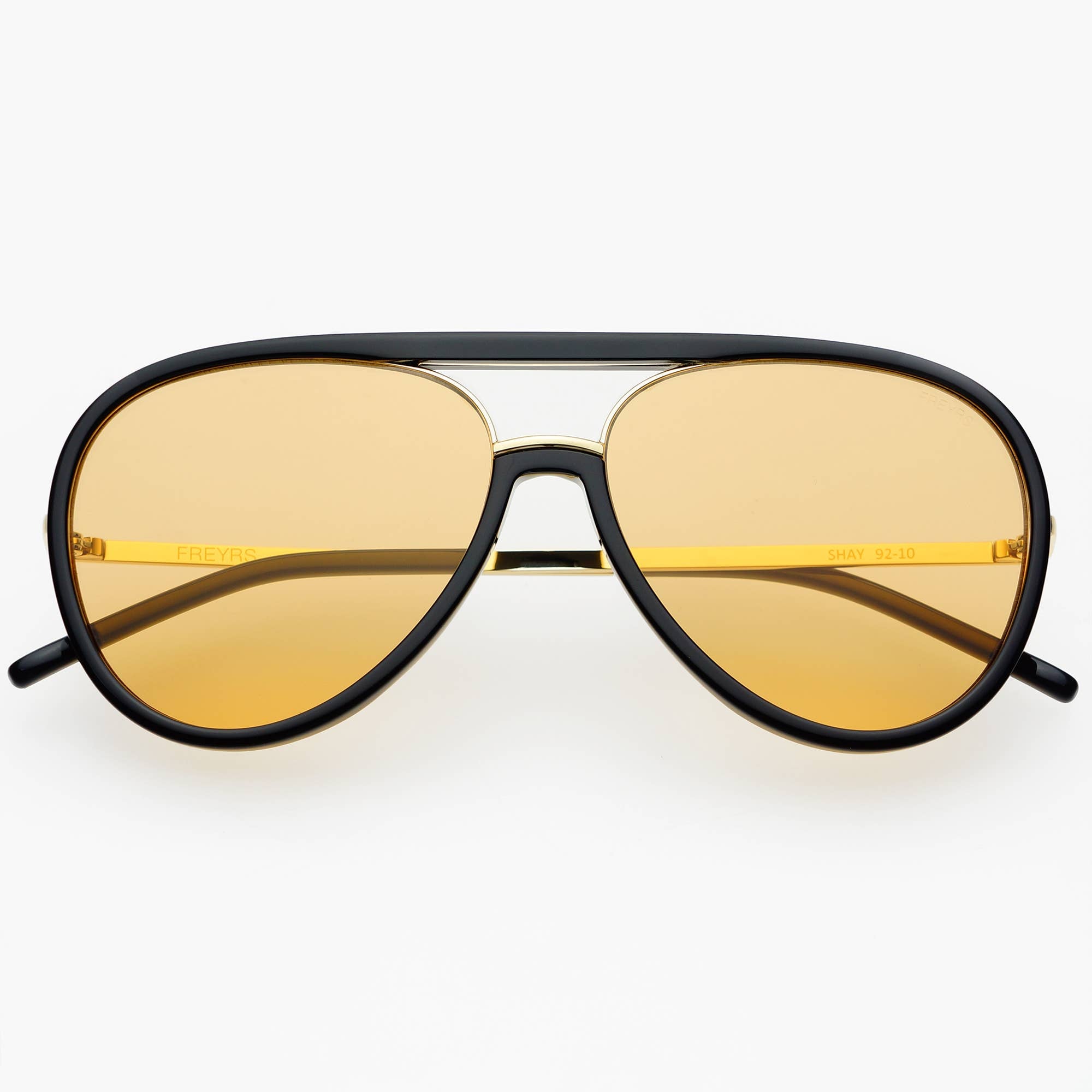 Aviator sunglasses with black frame and yellow lenses on a white background