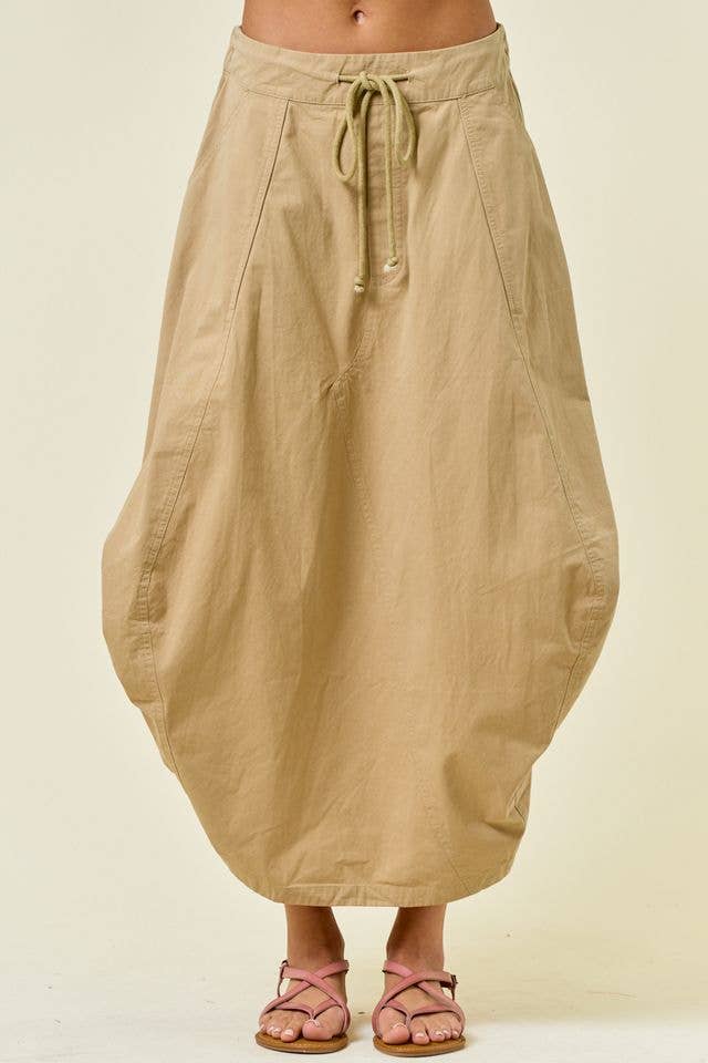 Beige skirt with a drawstring waist on a plain background