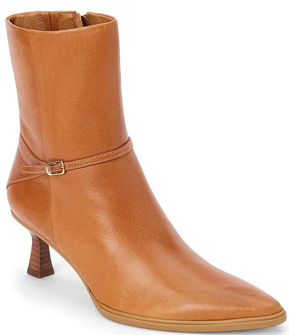 Tan leather boot with a buckle on a white background