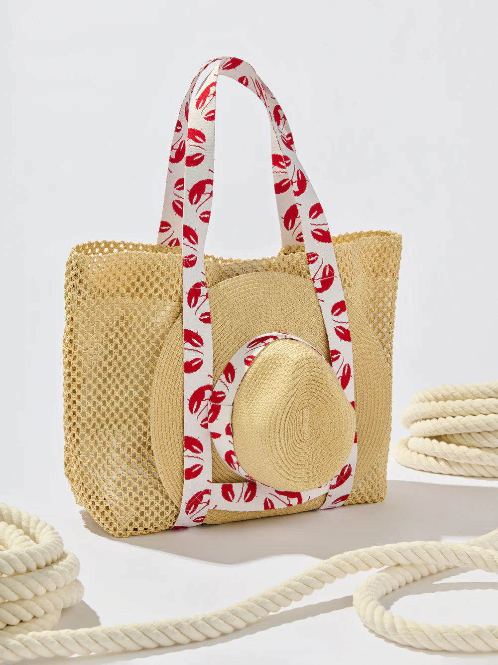 Woven bag with a red and white handle on a light gray background