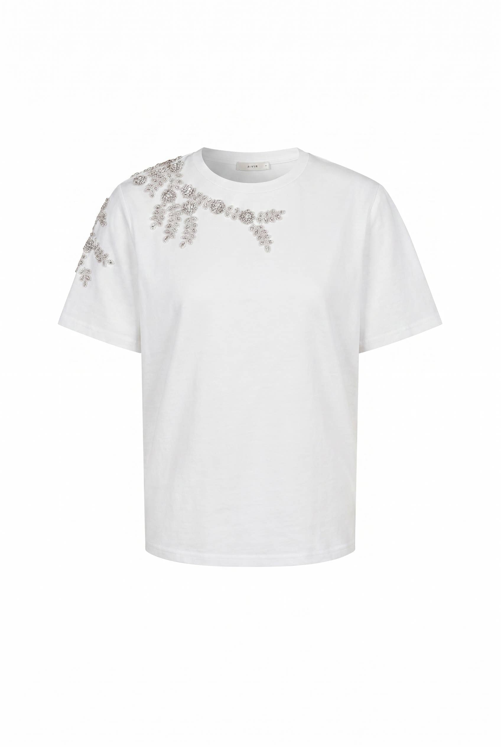 A white short-sleeve crewneck t-shirt featuring a decorative pattern of small metallic silver flowers and leaves printed or embroidered across the upper chest and right sleeve, shown against a plain white background.