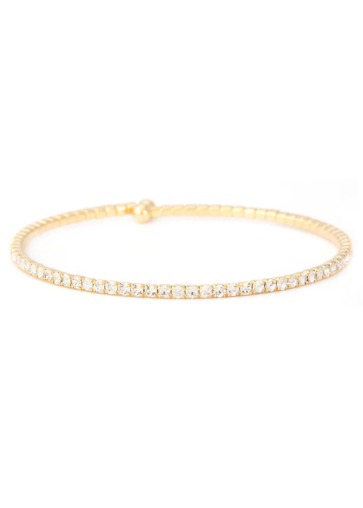 Gold bracelet with small diamonds on a white background