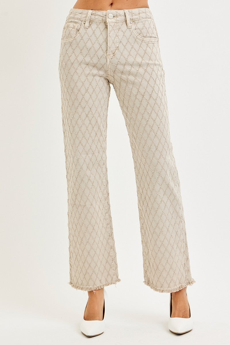 Quilted beige pants on a white background