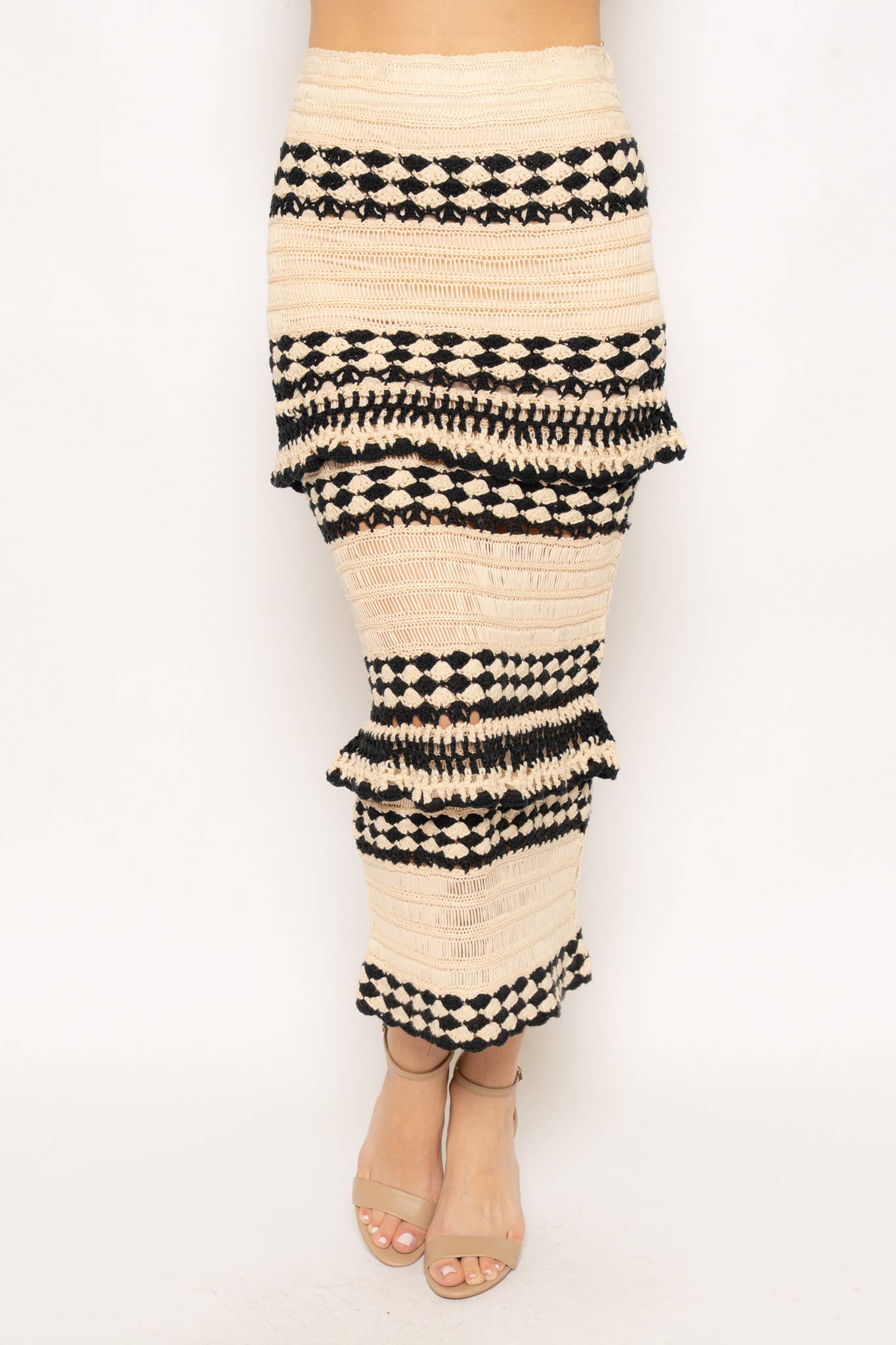 Beige and black patterned skirt on a white background