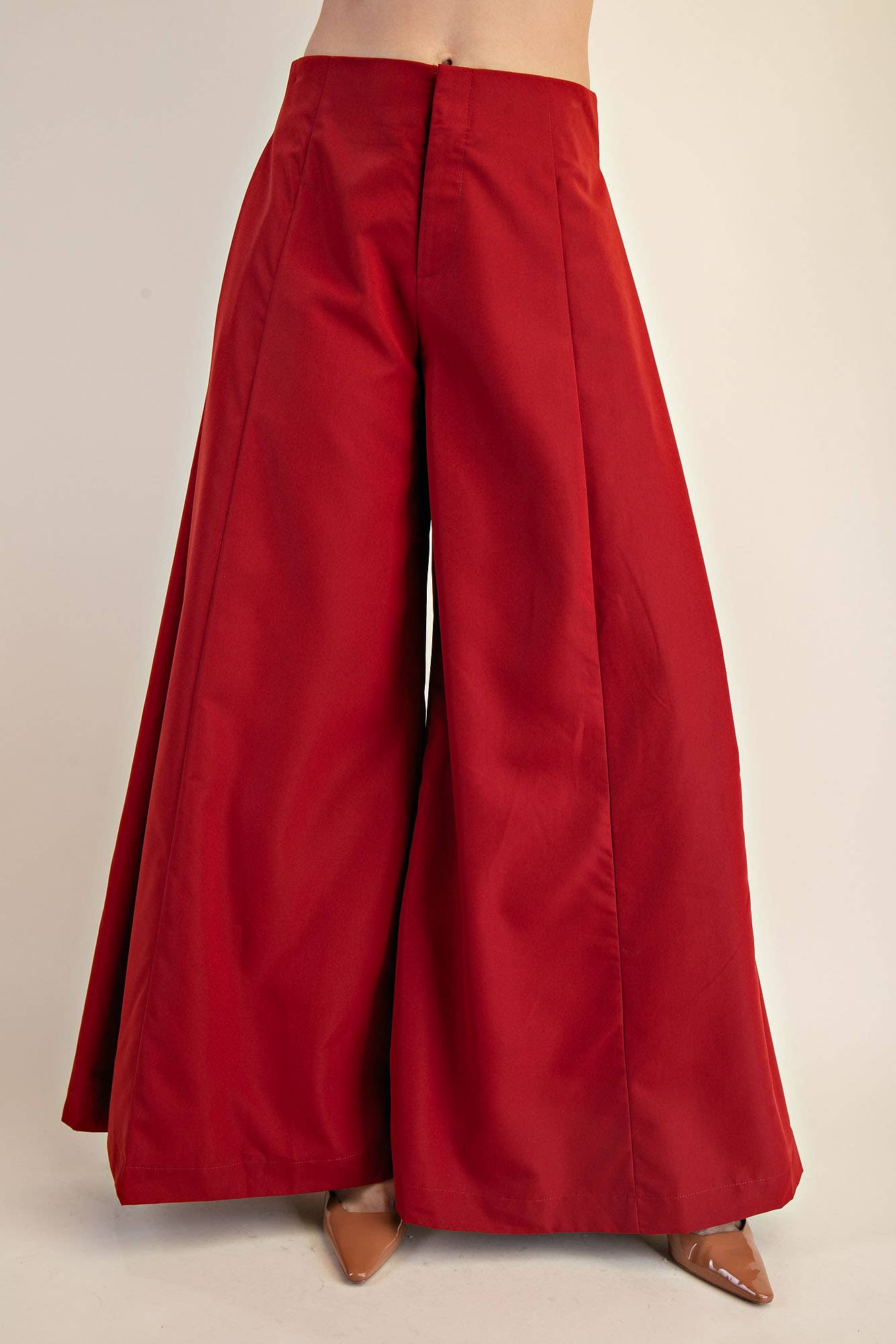 Red wide-leg pants on a plain background