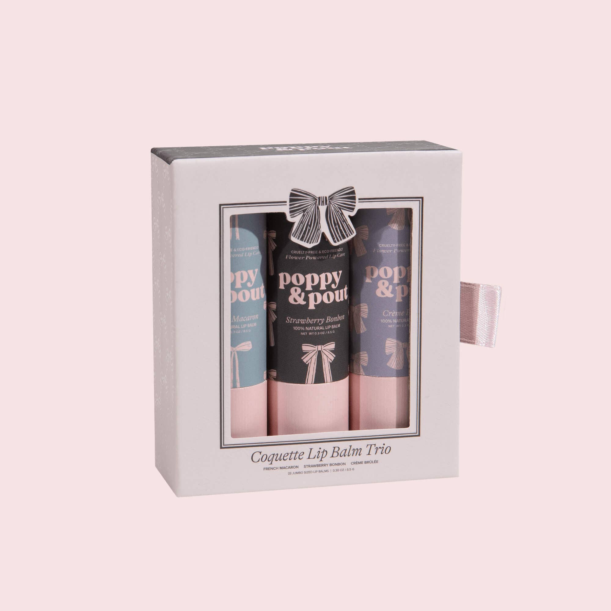 Poppy & Pour lip balm trio set in a decorative box on a light pink background