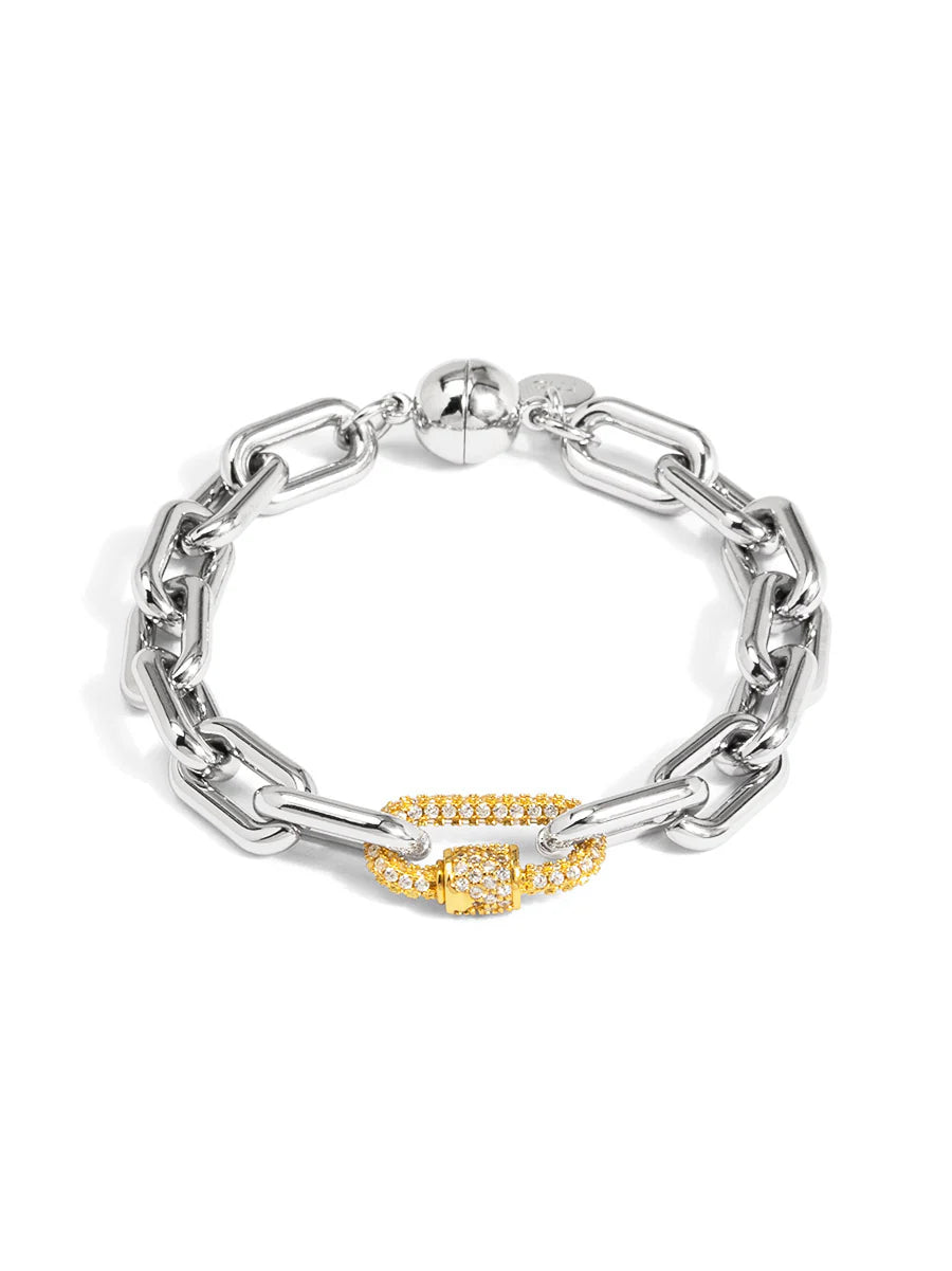 Silver chain bracelet with a gold clasp on a white background