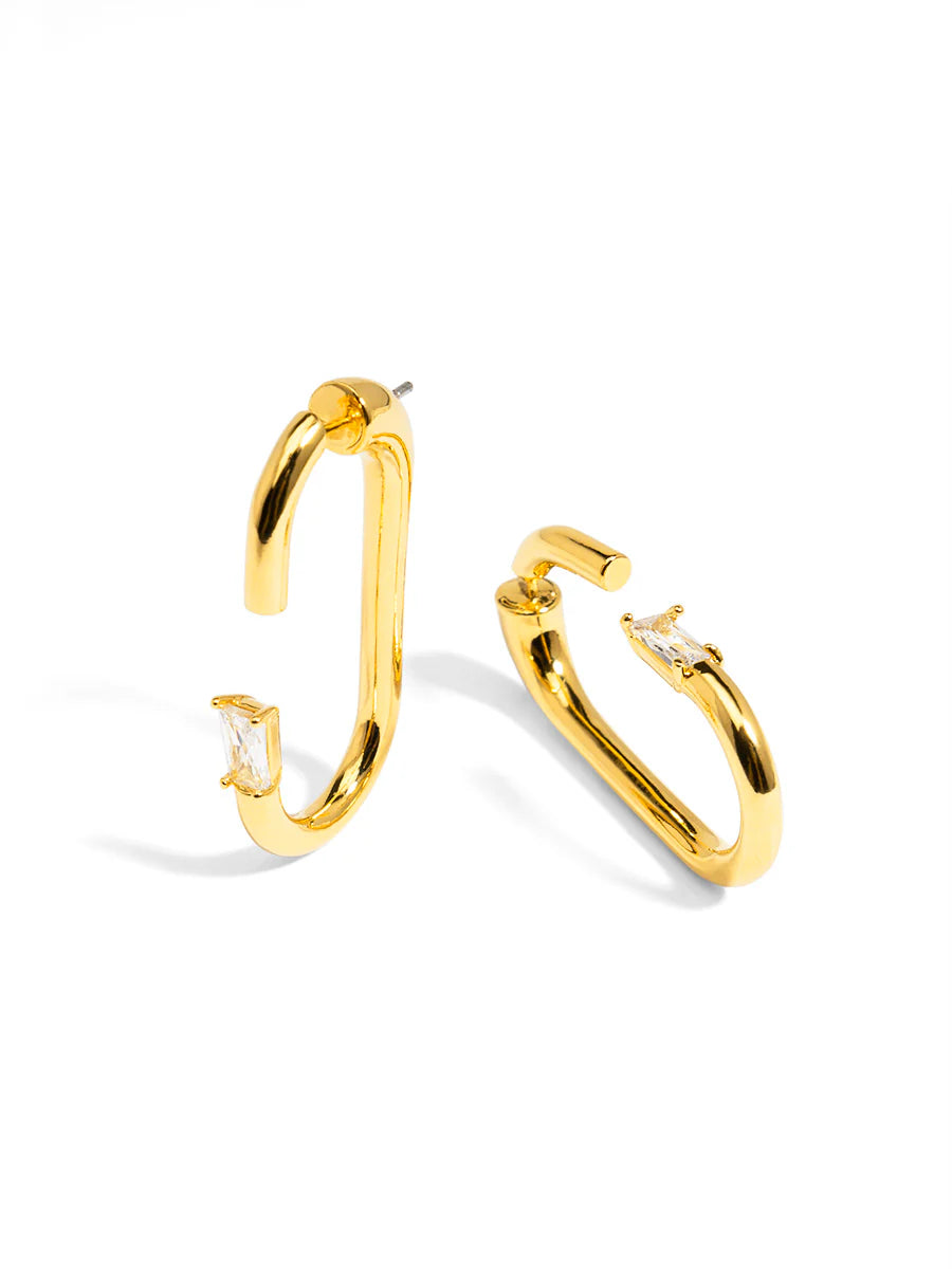 Gold hoop earrings on a white background
