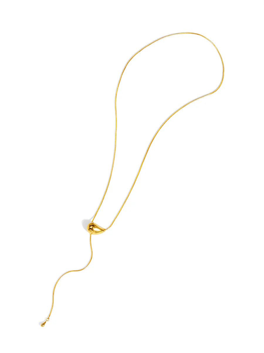 Gold necklace on a white background