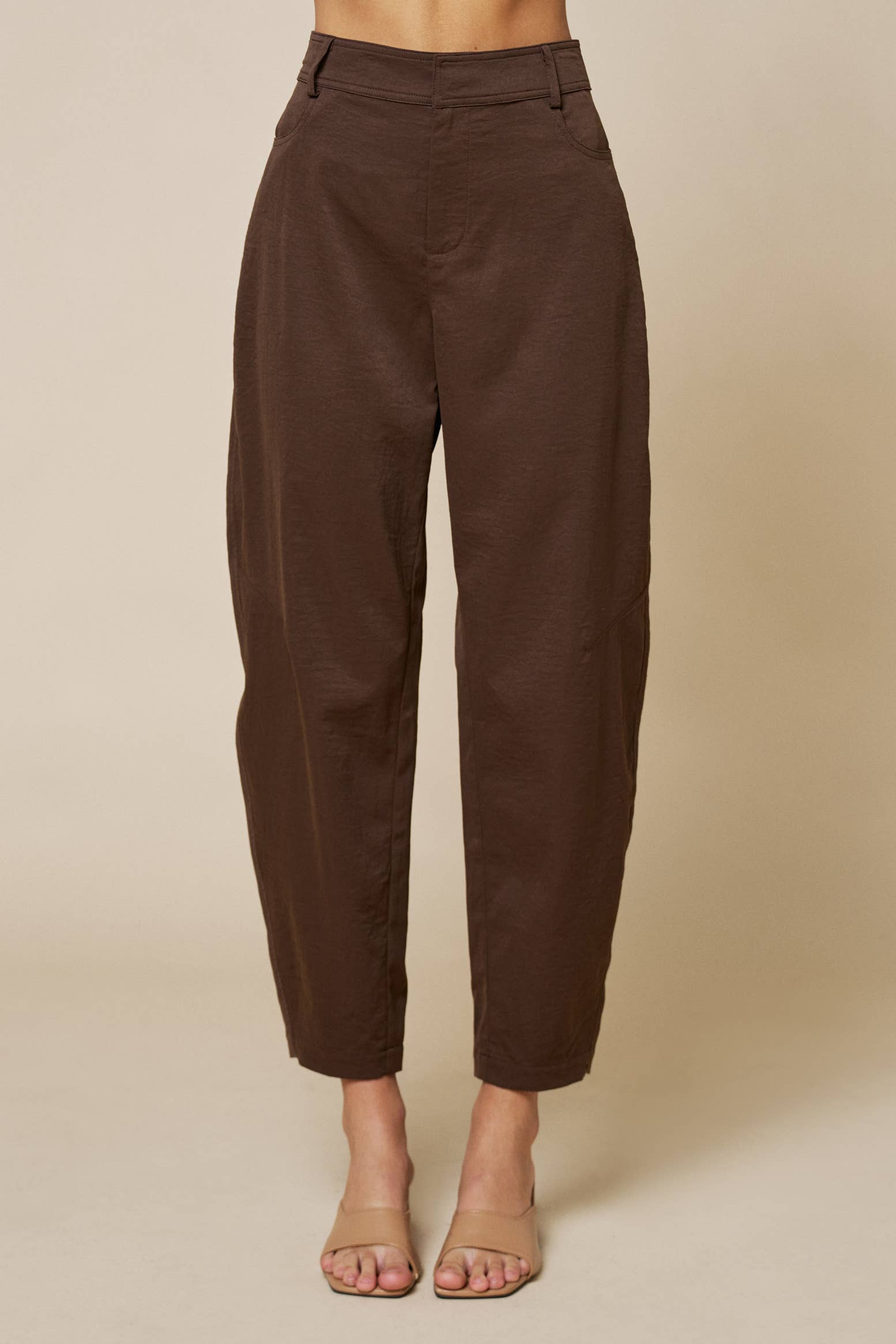 Brown pants on a beige background