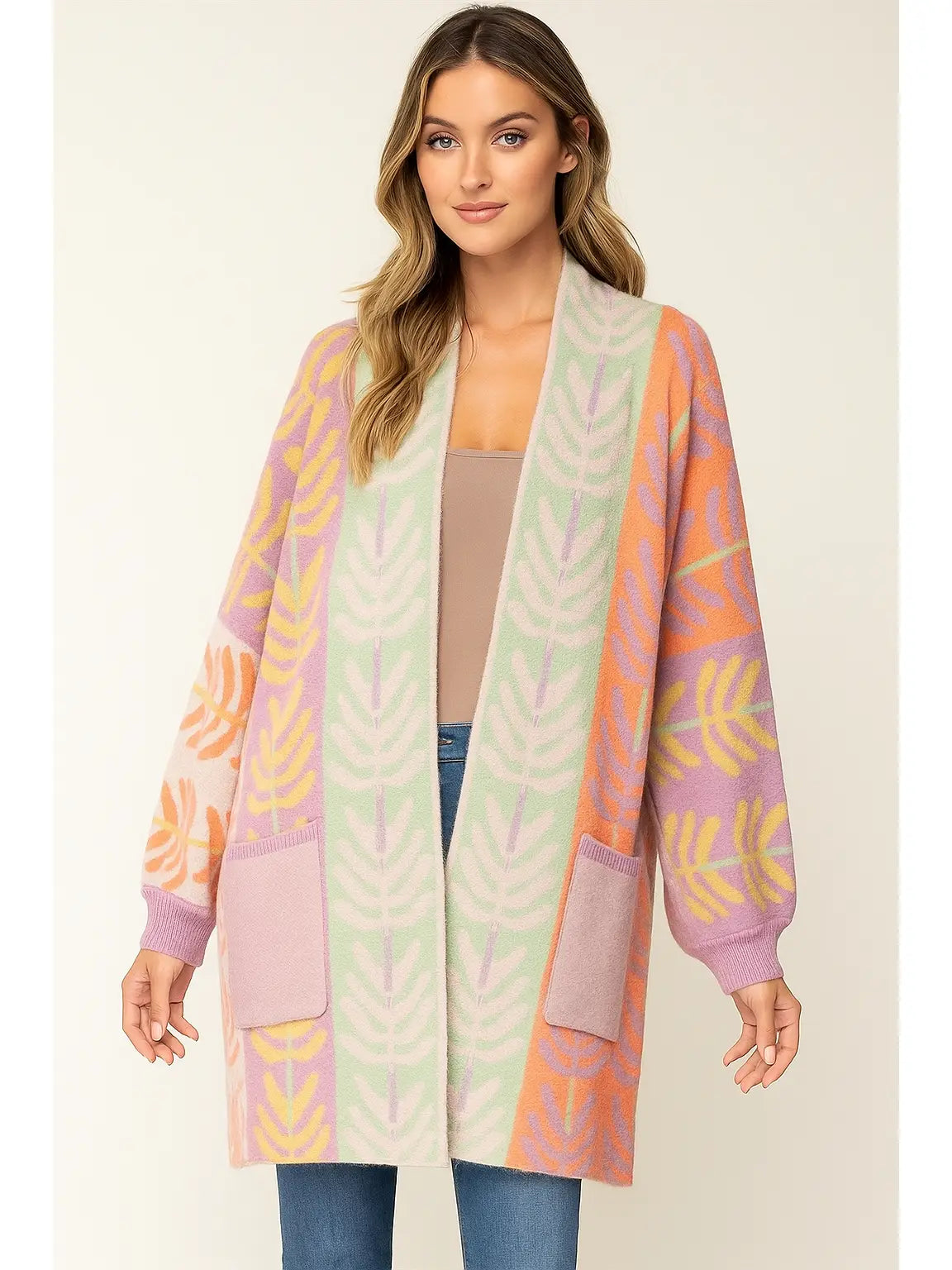 Woman wearing a colorful patterned cardigan on a beige background