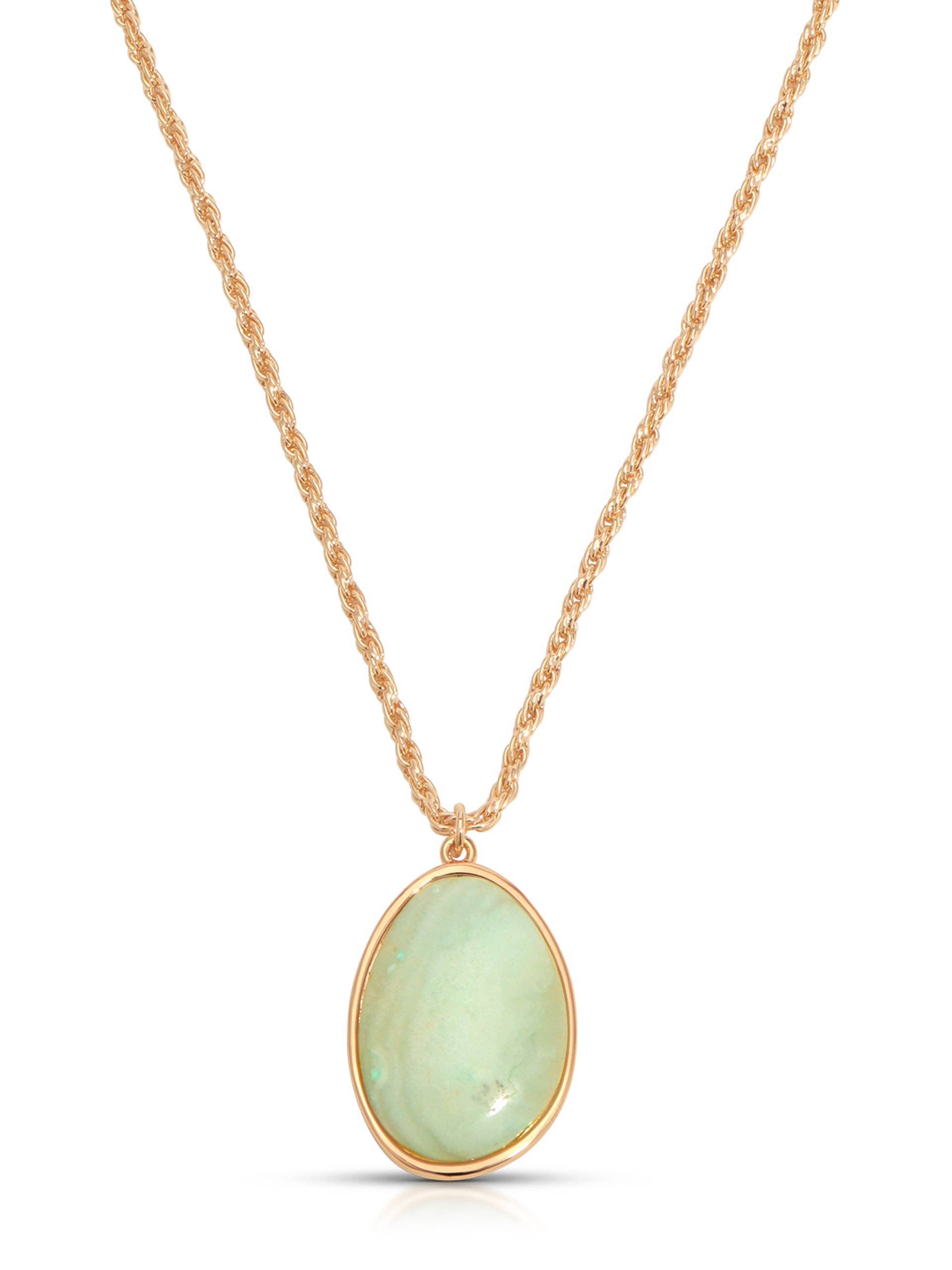 Gold necklace with a green pendant on a white background