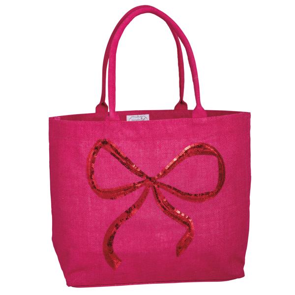 Pink tote bag with a red sequin bow on a white background